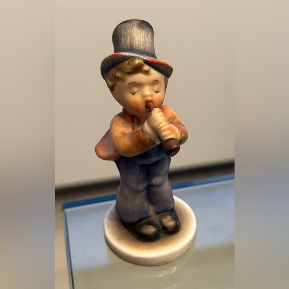 Antique collectible “Flute Player” porcelain ceramic figurine